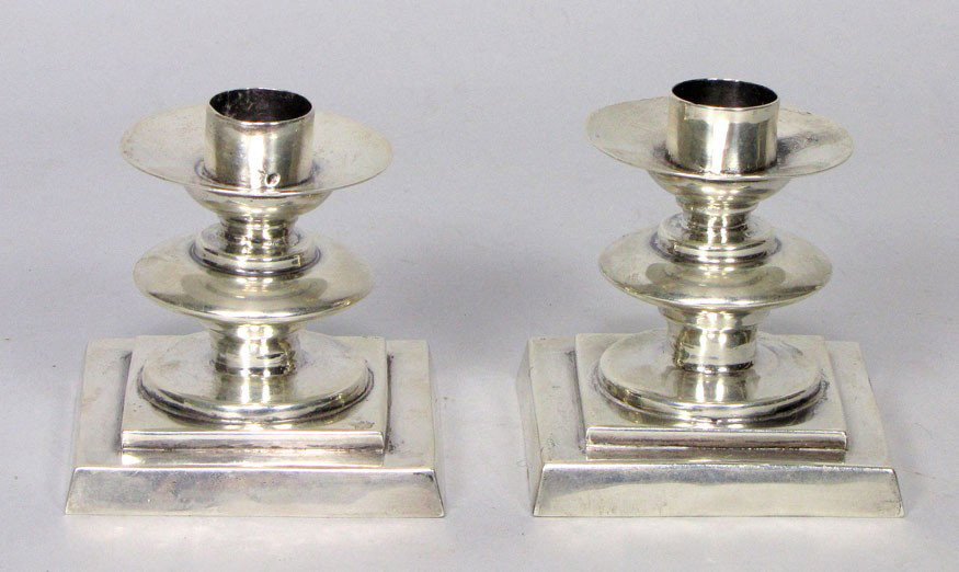 PAIR OF SPRATLING STERLING SILVER CANDLESTICKS: marked: Spratling Made in Mexico; Sterling square base, disc column with saucer bobeches, 3"h; base 3"square; 12 troy oz. William Spratling, (1900-1967) was an American-born silversmith and artist, be