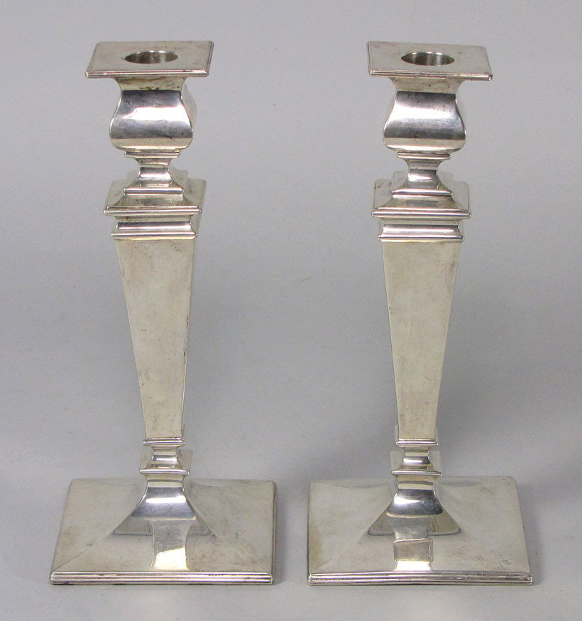 PAIR OF TIFFANY FEDERAL-STYLE STERLING SILVER CAND: marked: Made for Tiffany & Co. Sterling 1136x square, reverse tapered with urn socket and square bobeche, 9"h; 32 troy oz.
