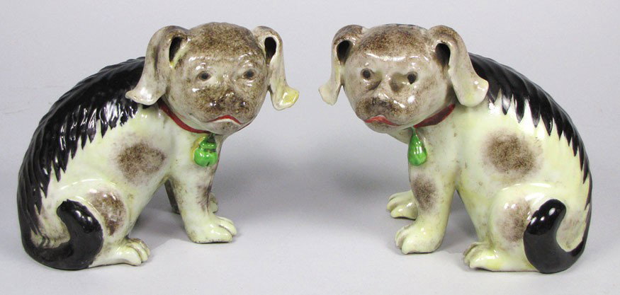 PAIR OF CHINESE EXPORT PORCELAIN SEATED SPANIELS: Qianlong, late 18th c. seated on haunches, red collar with green bell, the head turned forward with closed mouths, 6"h Estate of Mimi Houghton, Beacon Hill Boston See: David S. Howard, The Choice of t