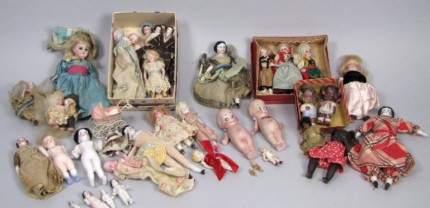 LARGE COLLECTION OF MINIATURE DOLLS: inc. bisque, porcelain, carved wood, (3) kewpies, baby dolls, fixed, (4) bisque black dolls, frozen Charlottes, early painted face, etc. Estate of Carol Ishimoto, Cambridge, MA