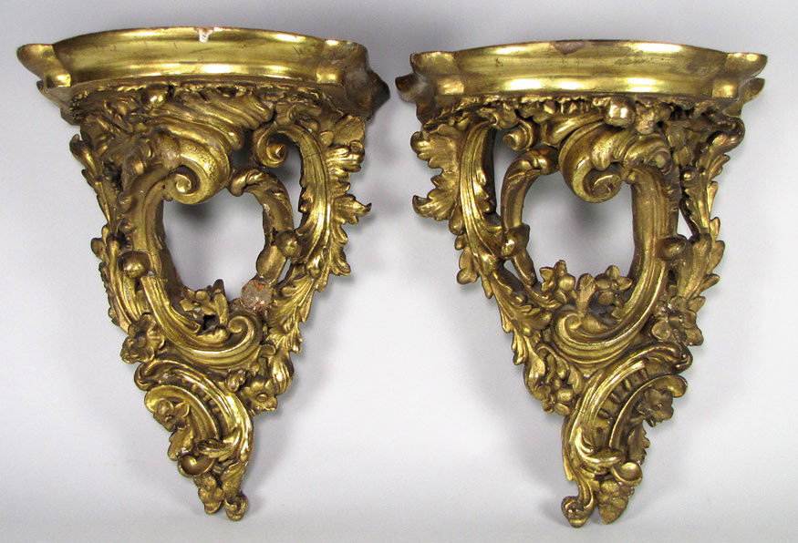 PAIR OF CONTINENTAL CARVED AND GILDED WALL BRACKET: with scrolling foliate design, 13.5"h; the platform 11"w