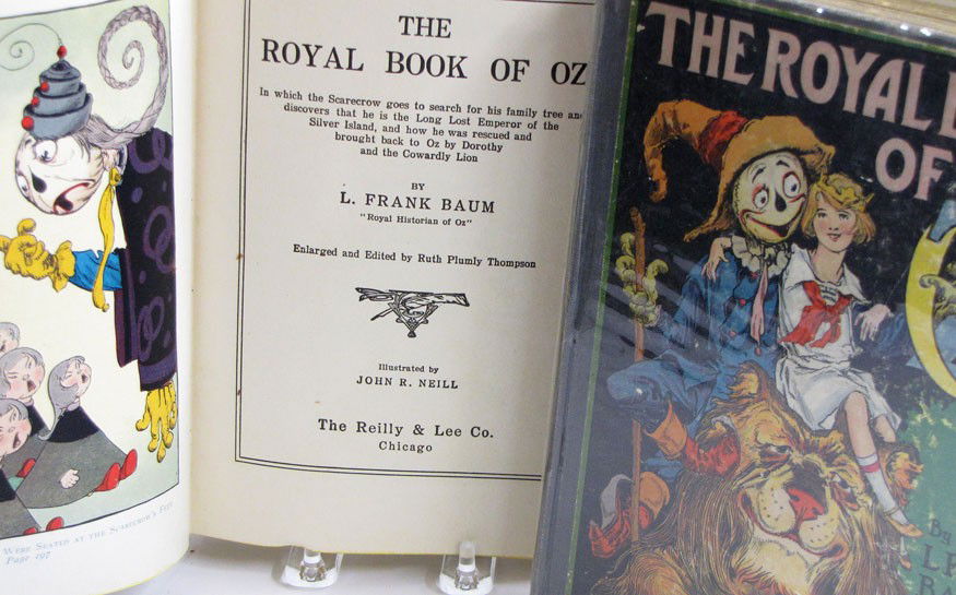 CHILDREN'S: (on 2) BAUM, L. FRANK: two copies of the same book The Royal Book of Oz; 1921, Reilly & Lee Co. Chicago color lithograph on cloth boards, 8vo (spine roughness, both have written inscriptions inside) Prov.: collection of Hen