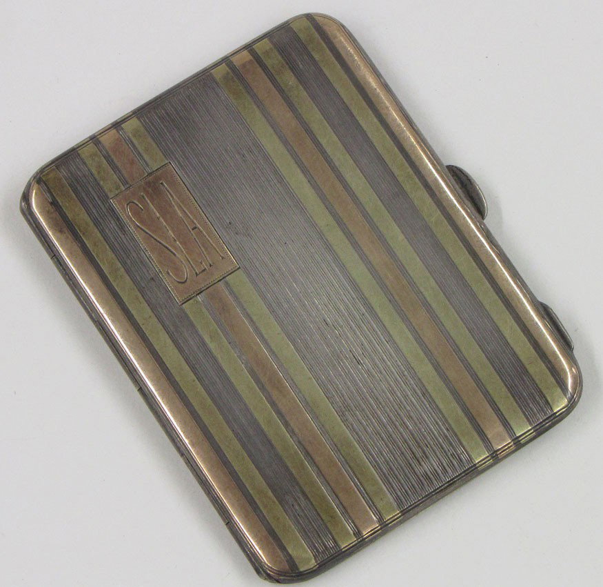 STERLING AND GOLD TRAVEL PHOTO CASE: marked 14k and sterling, makers mark of B with trident, engraved SLA, 3 by 2.25 in.