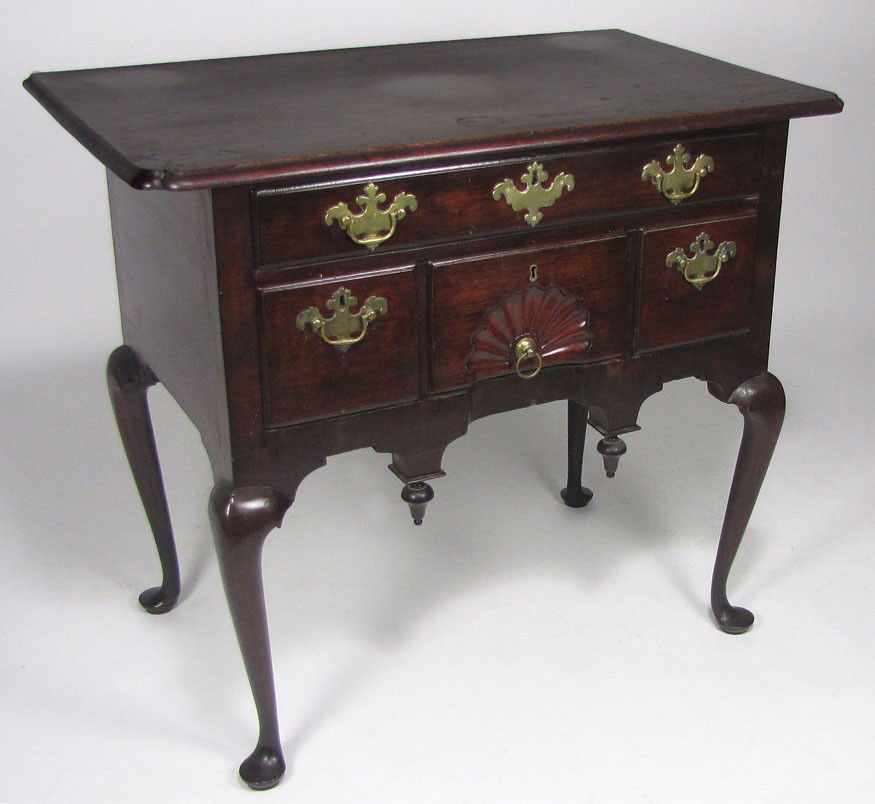 SALEM QUEEN ANNE WALNUT LOWBOY: molded top with notched corners, long drawer over three, the center with fan carving, bat-wing brass scrolled apron with drops, slender cabriole legs ending in pad feet 30”h; case 28”w; 18”d; to