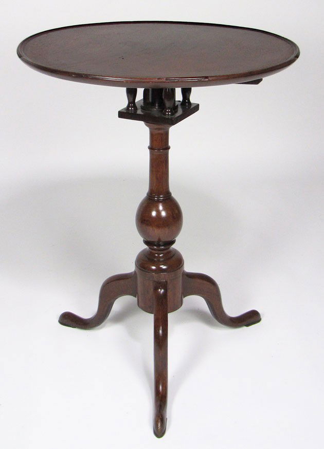 PENNSYLVANIA QUEEN ANNE WALNUT BIRD-CAGE TEA TABLE: c. 1770, dish top, cabriole legs ending in snake feet, 28.5”h; the tilting top 22” diam. Prov.: Roland Hammond, Andover, MA