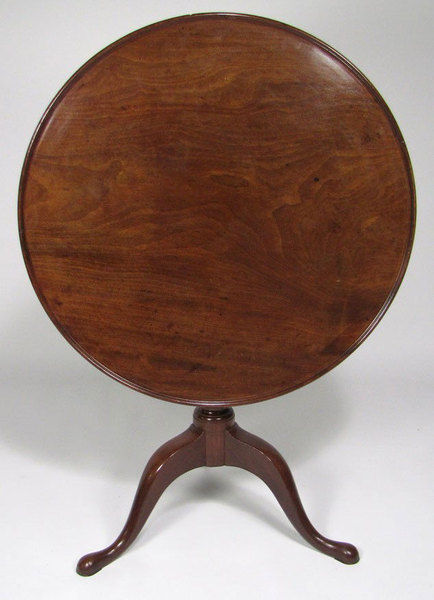 NEWPORT QUEEN ANNE MAHOGANY DISH-TOP TEA TABLE: c. 1770, bulbous-turned post, cabriole legs ending in pad feet the tilting top, 27.5”h; 32” diam. Prov.: Roland Hammond, Andover, MA