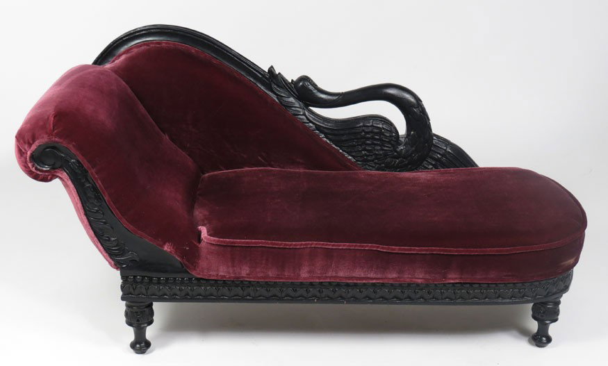 VICTORIAN EBONIZED CHILD’S FAINTING SOFA: with carved swan back, carved apron and turned legs, 18.5”h; 33”w