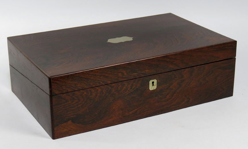 19TH C. ROSEWOOD LAP DESK: German silver inlaid cartouche in top and as escutcheon, fitted interior with ink bottles and pens, 5”h; 16”w; 10”d