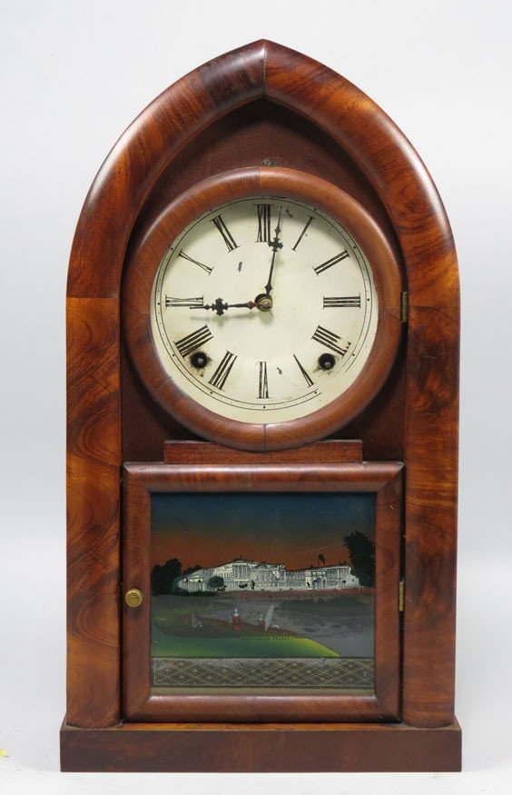 GOTHIC MAHOGANY BEEHIVE SHELF CLOCK: 19th c., dial having Roman numerals with time and strike 8-day movement, lower tablet with reverse landscape and Buckingham Palace, paper label inside reads, The Forestville Clock Co. Forestville, Con
