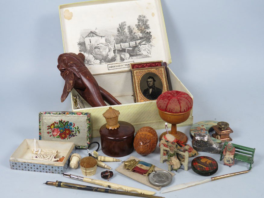 BOX LOT OF INTERESTING SMALL ITEMS: inc. treenware pin cushion; ivory sewing items; Victorian tape measures; ambrotype of gentleman; small tins; buttons; wood nutcracker; a 1902 coronation medal; (3) quill pens; etc.