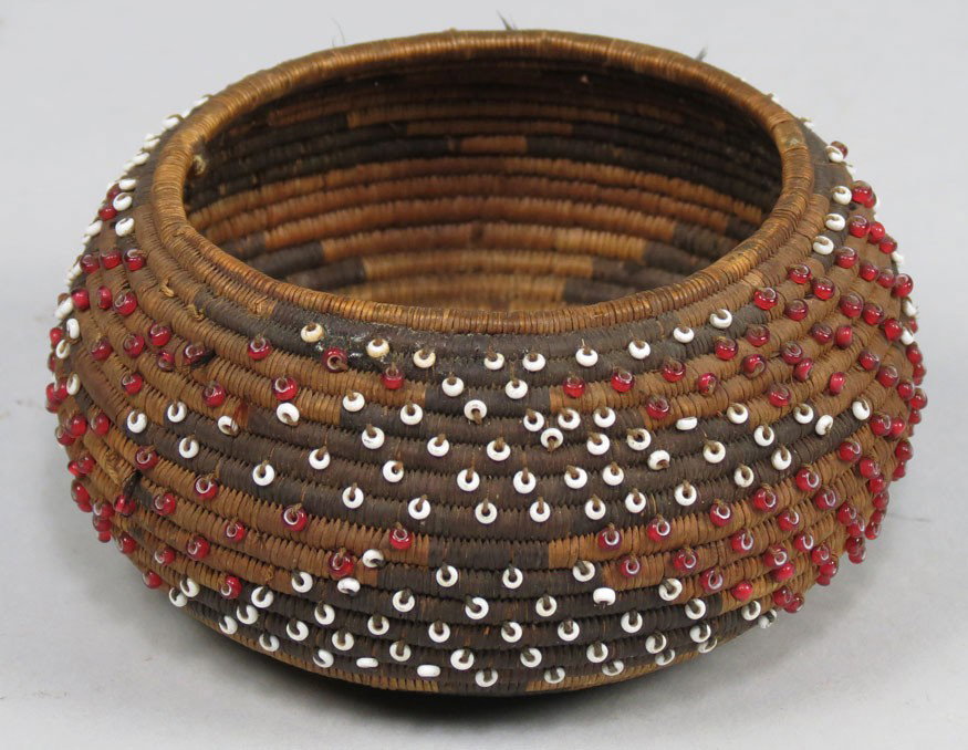NATIVE AMERICAN POMA BEADED GIFT BASKET: small round form with red and white bead decoration, and showing traces of original feathers, 1.75"h; 3.5" diam.