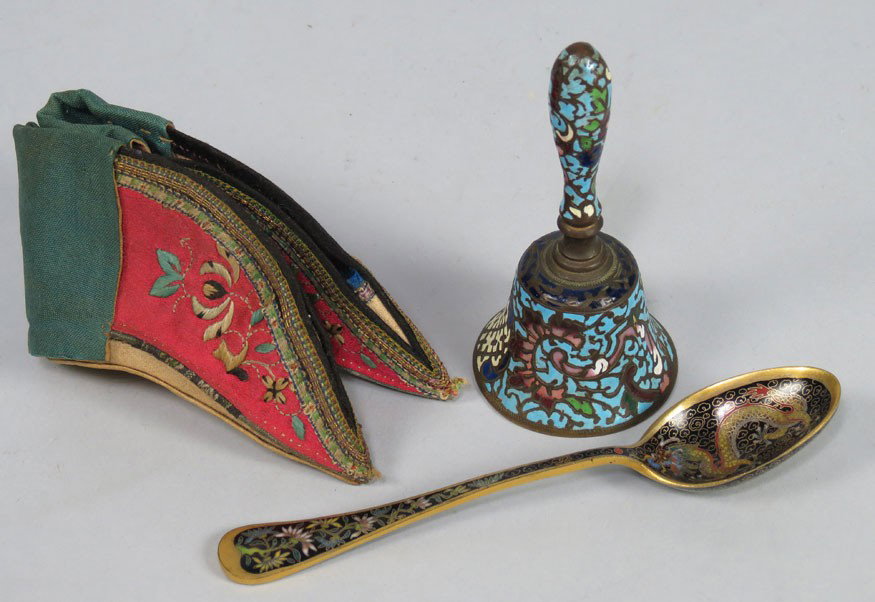 (on 3) VARIOUS CHINESE ITEMS: fine quality enamel teaspoon with dragon and floral decoration; a small champleve bell; and a pair of embroidered shoes for bound feet