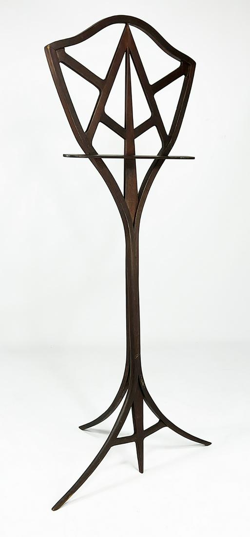 20TH C. CRAFT MOVEMENT HANDMADE MUSIC STAND: delicate curving wood in an Art Nouveau style, shield back on 3 splayed leg supports; 55"h; 22"w From a Private East Coast Collection NOTE: Apologies, we cannot appr