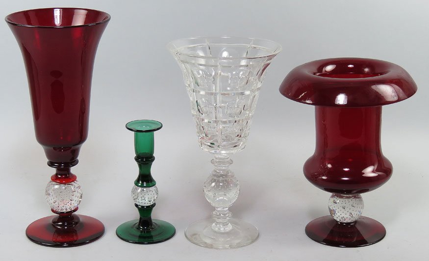(on 4) VARIOUS PAIRPOINT GLASS ITEMS: all with controlled bubble ball stems, two large ruby glass vases, 10.5”h and 13.5”h; a clear glass vase, 12”h; and an emerald glass candlestick, 7”h