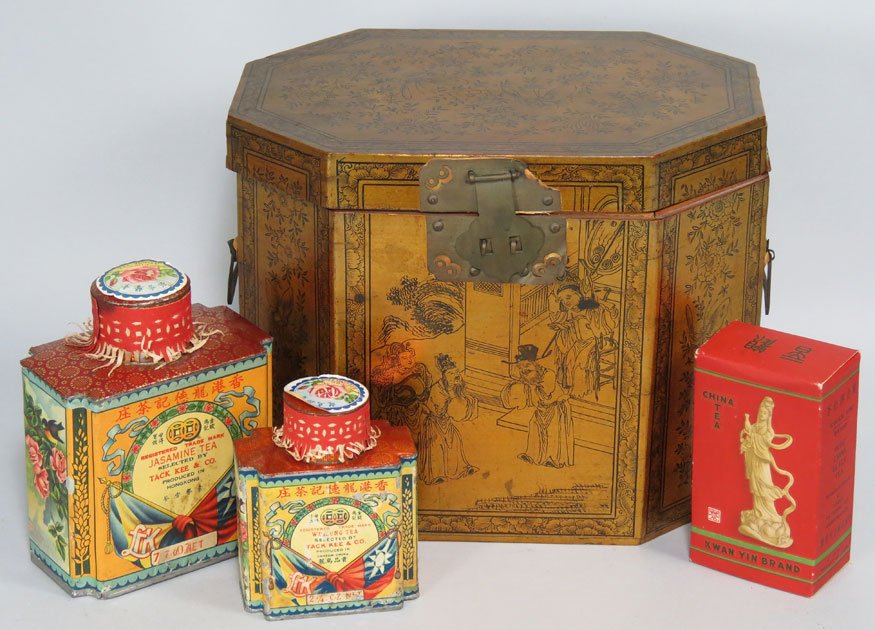 GENERAL STARK’S CHINESE TEA CADDY: hexagonal-form with black decoration on gold paint, pewter interior, along with two colorful decorated tea tins and a box of tea, never opened, 8.5”h; 10.5”w; 7”d typed note: Chinese tea caddy (