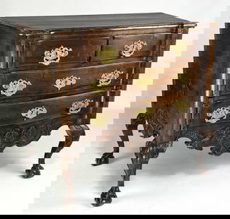 SMALL-SIZED PORTUGUESE ROCOCO SERPENTINE COMMODE: molded top over three serpentine drawers with ornate brass hardware; shaped, shell carved apron; sides also shell carved; acanthus caved knees; cabriole legs ending in ball and claw feet; 33"h; 3