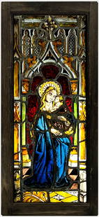 RELIGIOUS STAINED GLASS WINDOW: 18/19th c., Madonna and Child standing within a Gothic arch; details painted from the reverse; 33.5 by 15 in. (incl. 2"w later frame)NOTE: Apologies, we cannot approve bidders during the auction.