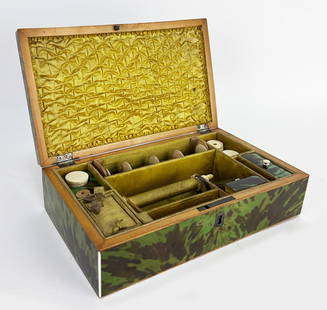 SMALL ENGLISH EDWARDIAN SHELL SEWING BOX: green shell, fitted completely with various sewing implements, compartments; the inside of the hinged lid finely tufted; 2.5"h; 9"w; 5"dNOTE: Apologies, we cannot approve bidders during