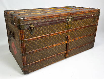 LOUIS VUITTON STEAMER TRUNK, 165583: monogram EDM; side travel decals inc. Grand Hotel; 23.5" h; 43.5" w; 22.5" dNOTE: Apologies, we cannot approve bidders during the auction.