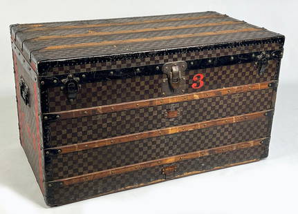 LOUIS VUITTON STEAMER TRUNK: label LOUIS VUITTON LONDON/PARIS #37312; tray insert; iron drop handles and hardware; side monogram in red E.B.B.; inset casters; 23"h; 39.5"w; 21.5"d