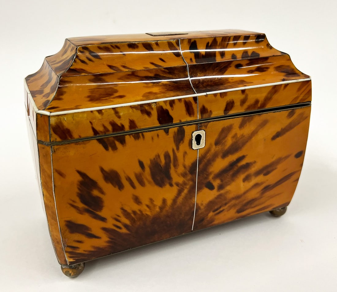 ENGLISH REGENCY DOUBLE TEA CADDY: c. 1810, sarcophagus-form; double shell-lidded interior; silver escutcheon and blank plaque to lid; metal ball feet; 6.5"h; 8"w; 4"d NOTE: Apologies, we cannot approve bidders during th