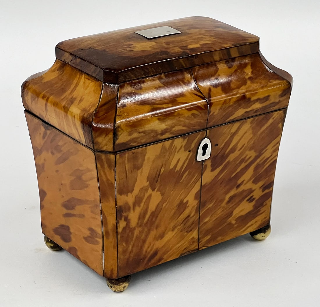 ENGLISH GEORGIAN DOUBLE TEA CADDY: tapering rectangular-form; silver escutcheon and blank lid plaque; double lidded interior; brass ball feet; 6"h; 6.5"w; 4.5"d NOTE: Apologies, we cannot approve bidders during the aucti
