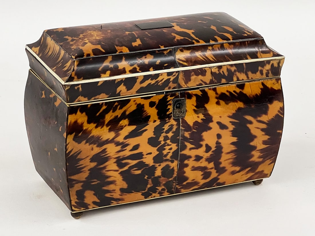 ENGLISH GEORGIAN DOUBLE TEA CADDY: Bombay-form; double lidded interior; brass ball feet; 5.25"h; 7"w; 4"d NOTE: Apologies, we cannot approve bidders during the auction.