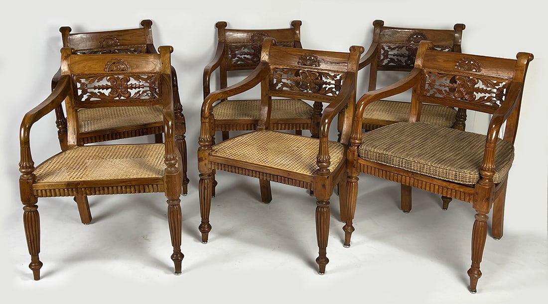 SET OF (6) 19TH C. ANGLO-INDIAN ARMCHAIRS: carved hardwood; fluted arm supports and tapering legs; caned seats with cushions; 33"h; 23.5"w; 18"d; seat height 19" with cushionNOTE: Apologies, we cannot approve bidders during