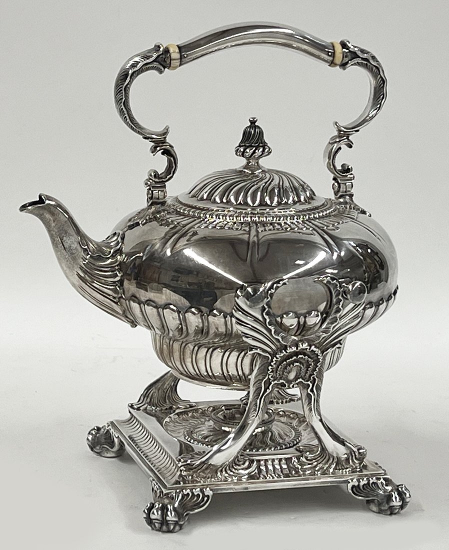 TIFFANY STERLING SILVER TILTING KETTLE ON STAND: kettle, stand and burner marked TIFFANY & CO. / 7224 makers 7206 /Sterling Silver/ 925-1000 / M; 4.5 pints; 12" with handle raised; 72.78 troy oz. NOTE: Apolo