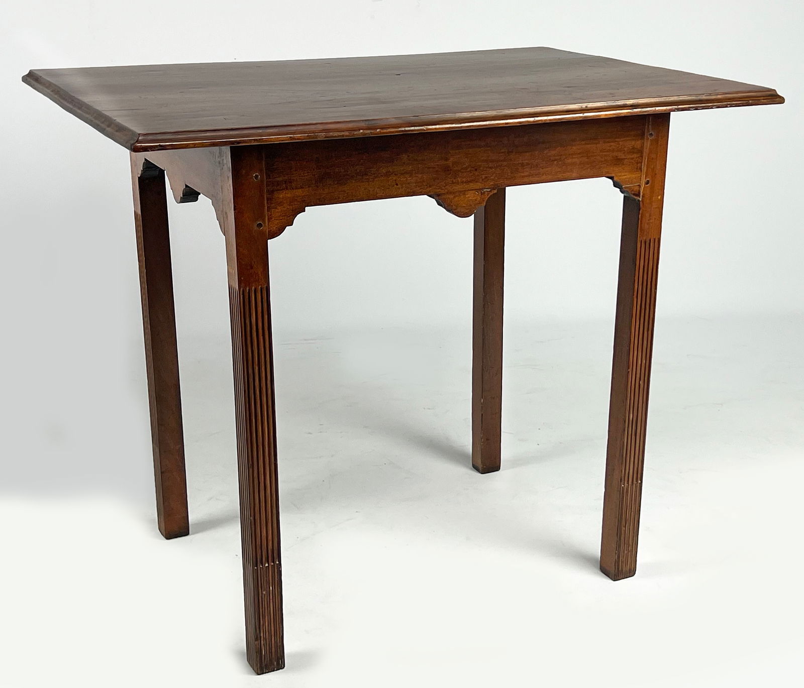 RARE NEWPORT CHIPPENDALE SAN DOMINGO MAHOGANY TEA TABLE: c. 1750-70, attrib. John Townsend, Newport, Rhode Island molded edge, overhanging top; shaped apron; stop fluted legs; 27"h; top 32.5"w, 23"d; base 23"w, 18"d Prov.: A New York couple, purchased from