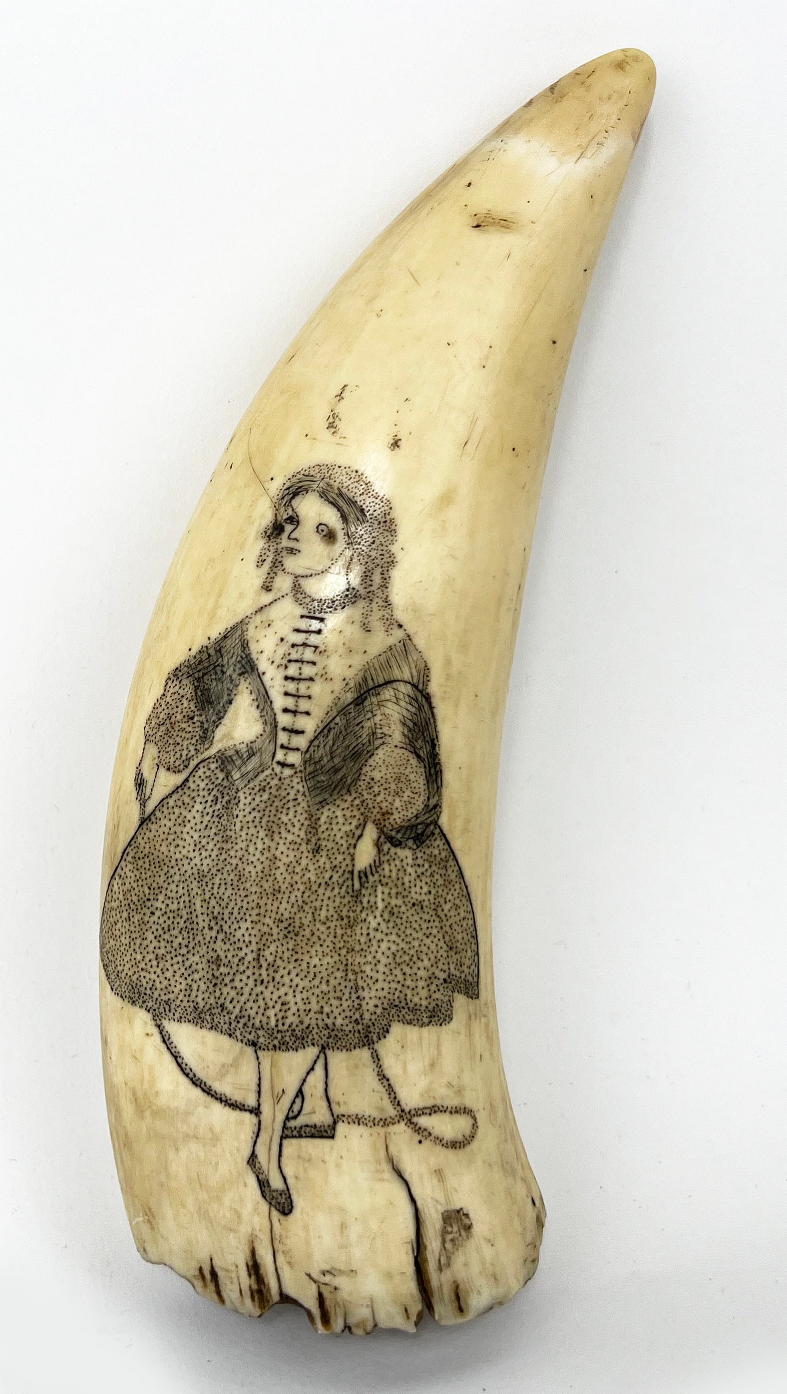 19TH C. SCRIMSHAW WHALE TOOTH: decorated with full figure of a woman wearing a pin-prick dress and bonnet; reverse undecorated; 4.5"; 2.25"at base NOTE: Apologies, we cannot approve bidders during the auction.