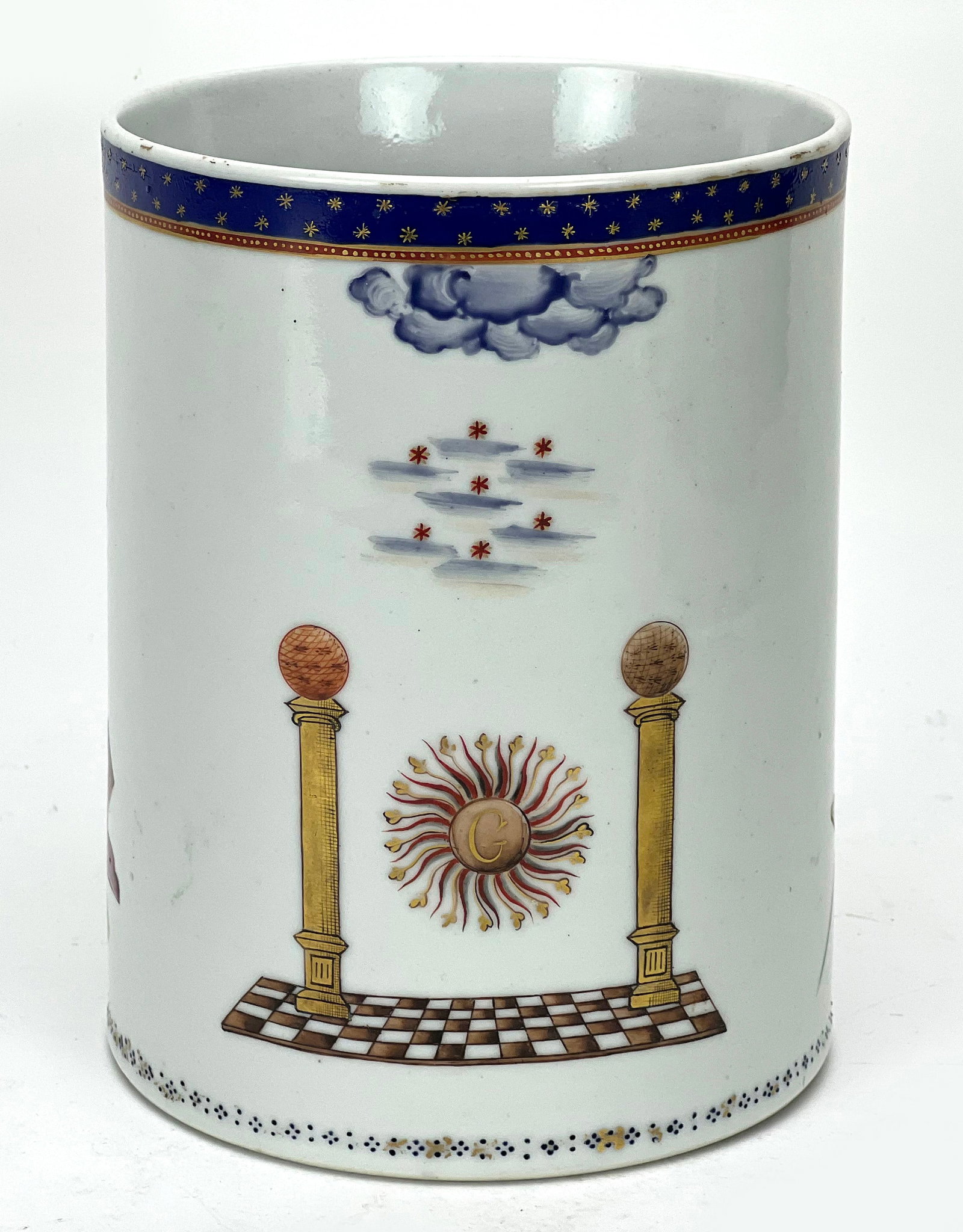 CHINESE EXPORT PORCELAIN MASONIC TANKARD: mid 19th c., vivid and various Masonic decoration, double strap handles; rim with blue band with gold stars; 6"h; opening 4.75"diam. NOTE: Apologies, we cannot approve bidders during the auction.