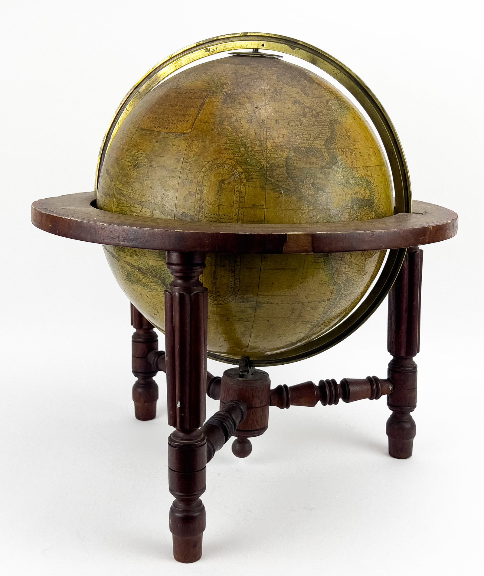 MALBY TERRESTRIAL TABLE GLOBE, 12": Thomas Malby & Son...Agent George Philip & Son, London c. 1886, walnut stand with fluted legs; 20" total h2 NOTE: Apologies, we cannot approve bidders during the auction.