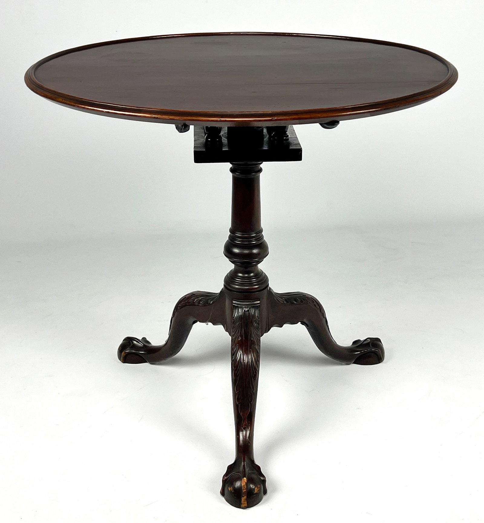 PHILADELPHIA CHIPPENDALE MAHOGANY TEA TABLE: tilting dish-top; acanthus carved knees; ball and claw feet; 28"h; 31"diam. NOTE: Apologies, we cannot approve bidders during the auction.