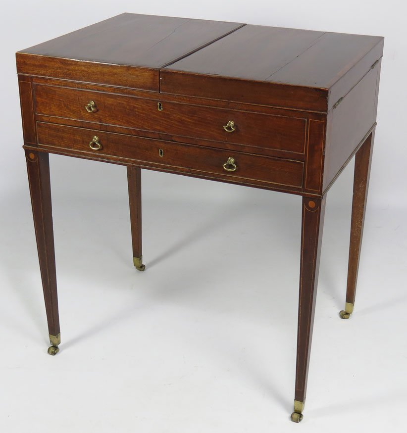 ENGLISH GEORGE III MAHOGANY DRESSING TABLE: the side-hinged rectangular with center split folds out to either side, fitted with adjustable mirror flanked by lidded compartments, drawer below, on tapering legs ending in brass cup casters, 30”h