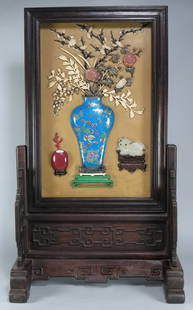 19TH C. CHINESE SCHOLAR’S TABLE SCREEN: decorated with blue cloisonné vase with ivory, rose quartz, jade and hardstone flowers and foliage, a mutton jade mythical animal on stand to one side, an oxblood vase with coral sprig to other, scre