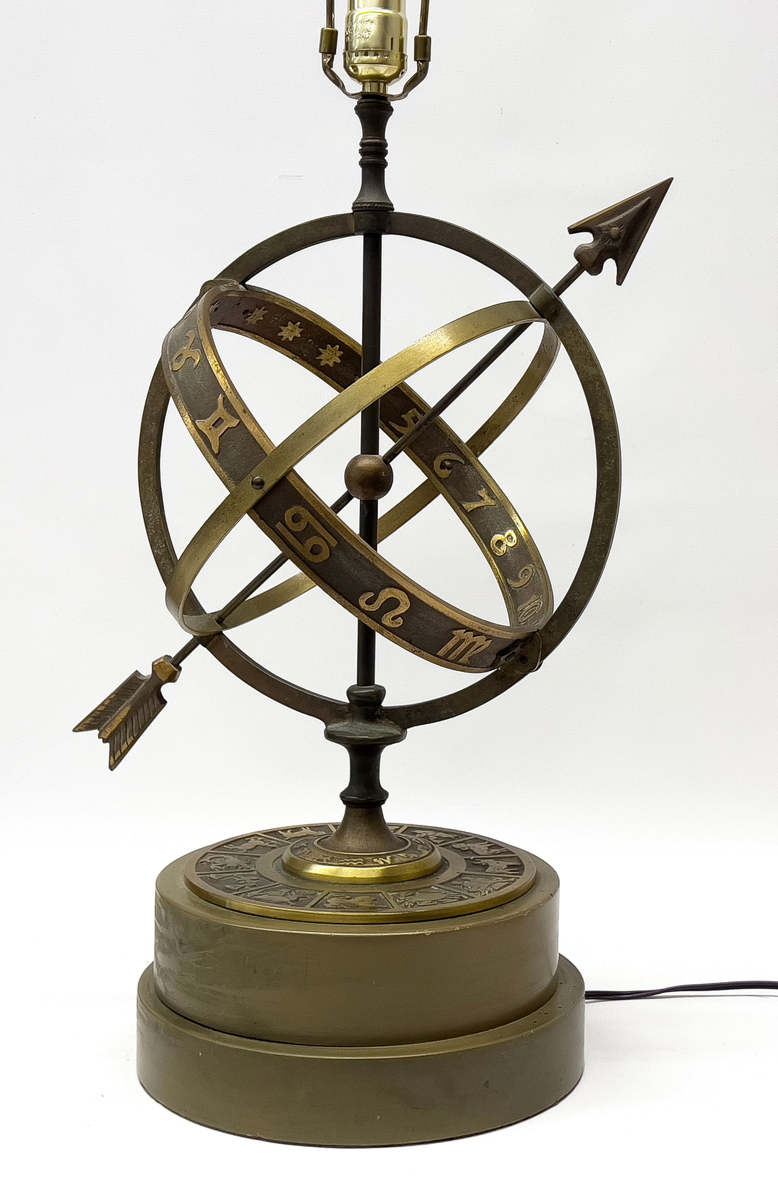 MID-CENTURY MODERN ARMILLARY-FORM, ZODIAC TABLE LAMP, COOPER: Frederick Cooper; bronze armillary sphere mounted on round, stepped wood base 10"diam., 4"h; 32"h to top of finial Cooper, initially a sculptor and painter, started designing table lamps in 1920's. Hi