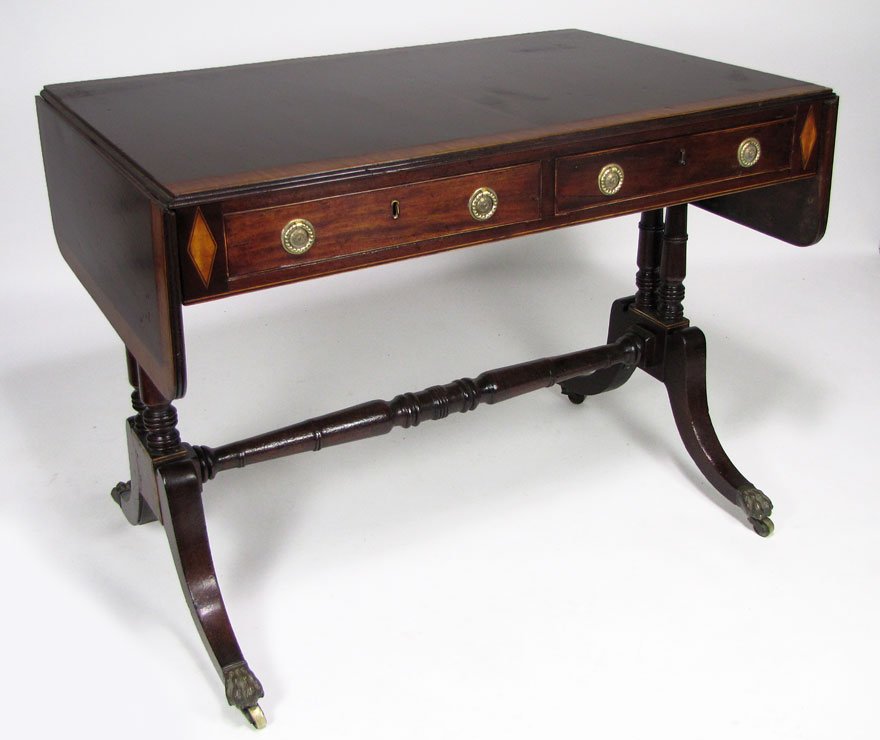 ENGLISH GEORGE III INLAID MAHOGANY SOFA TABLE: two working apron drawers, two false drawers to other side turned side supports joined by turned stretcher, brass paw feet with casters, 28.5"h; 36"w, with 9" drop leaves; 24"d