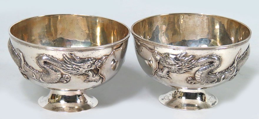 MATCHES THE PREVIOUS LOT: PAIR OF SMALL SILVER BOWLS: smaller, the dragons facing eachother maker: Sing Fat, three hallmarks: a Chinese glyph; SF and 90 3.25”h; 5”diam.; 16.75 troy oz. total (See detailed provenance information in Lot 279A)