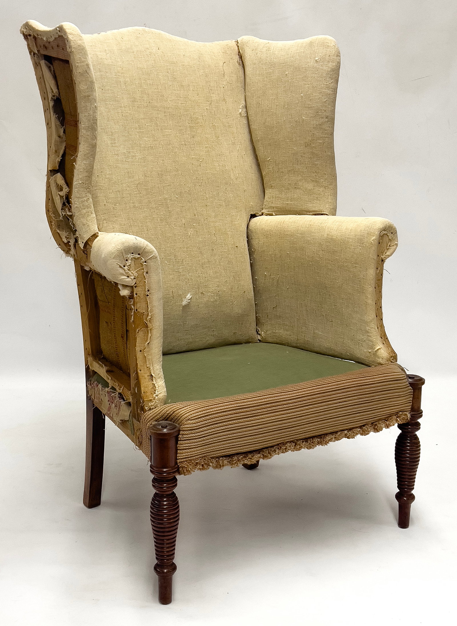 NEW HAMPSHIRE SHERATON MAHOGANY WING CHAIR: Portsmouth, unusual ring-turned, tapering front legs; 47.5"h; seat 16"h, 29:w