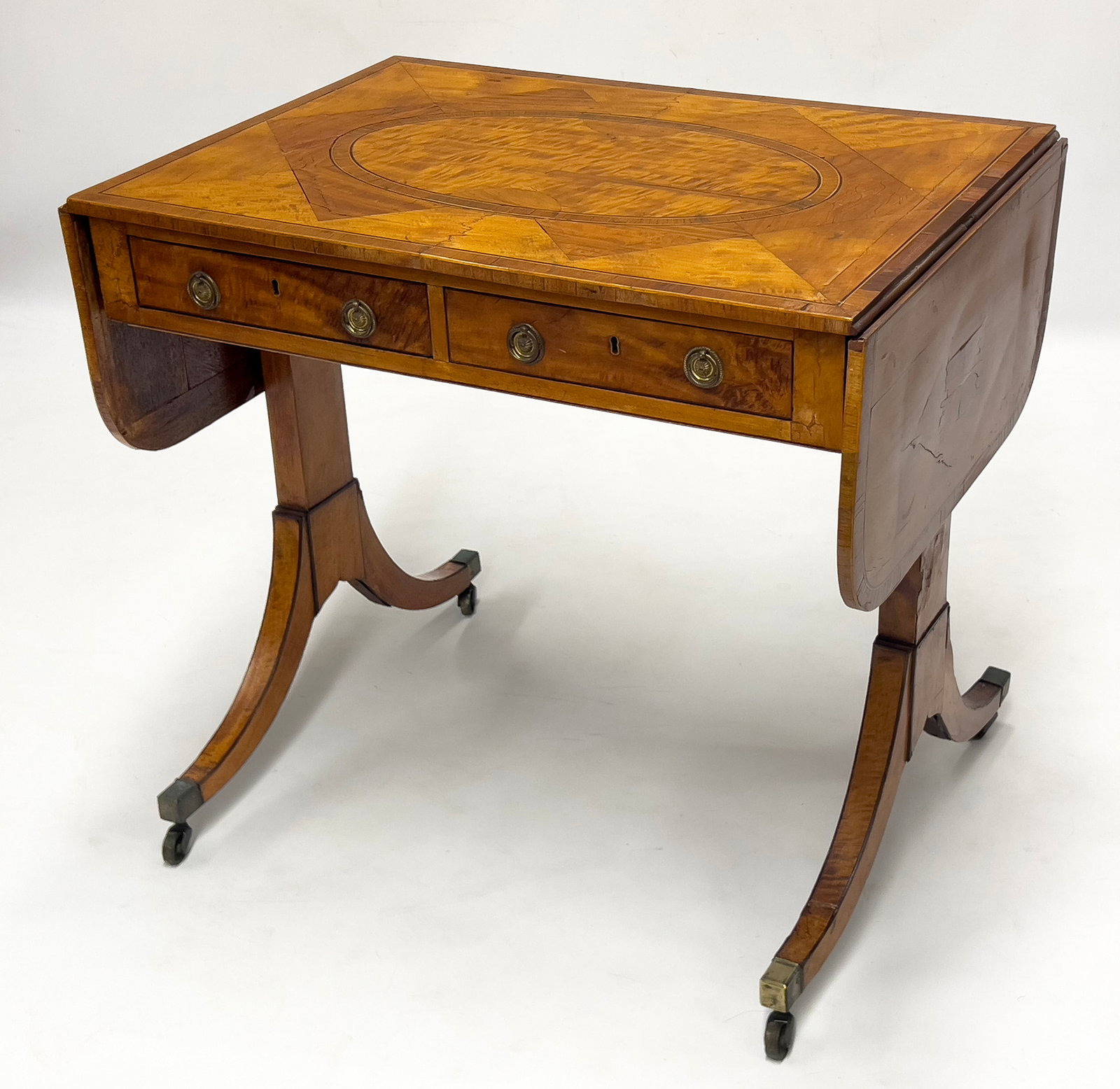 two apron drawers, false drawers to reverse; drop leaves; on casters 28.5"h; 31,5"w; with leaves up (1 of 2)