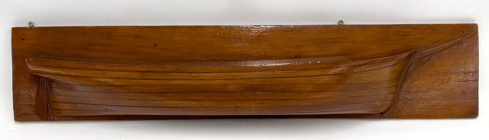 SHIP BUILDERS’S STACKED HALF HULL MODEL: shellac finish; 6- layers; hull 7"h by 44"long; board 10"h by 48"long