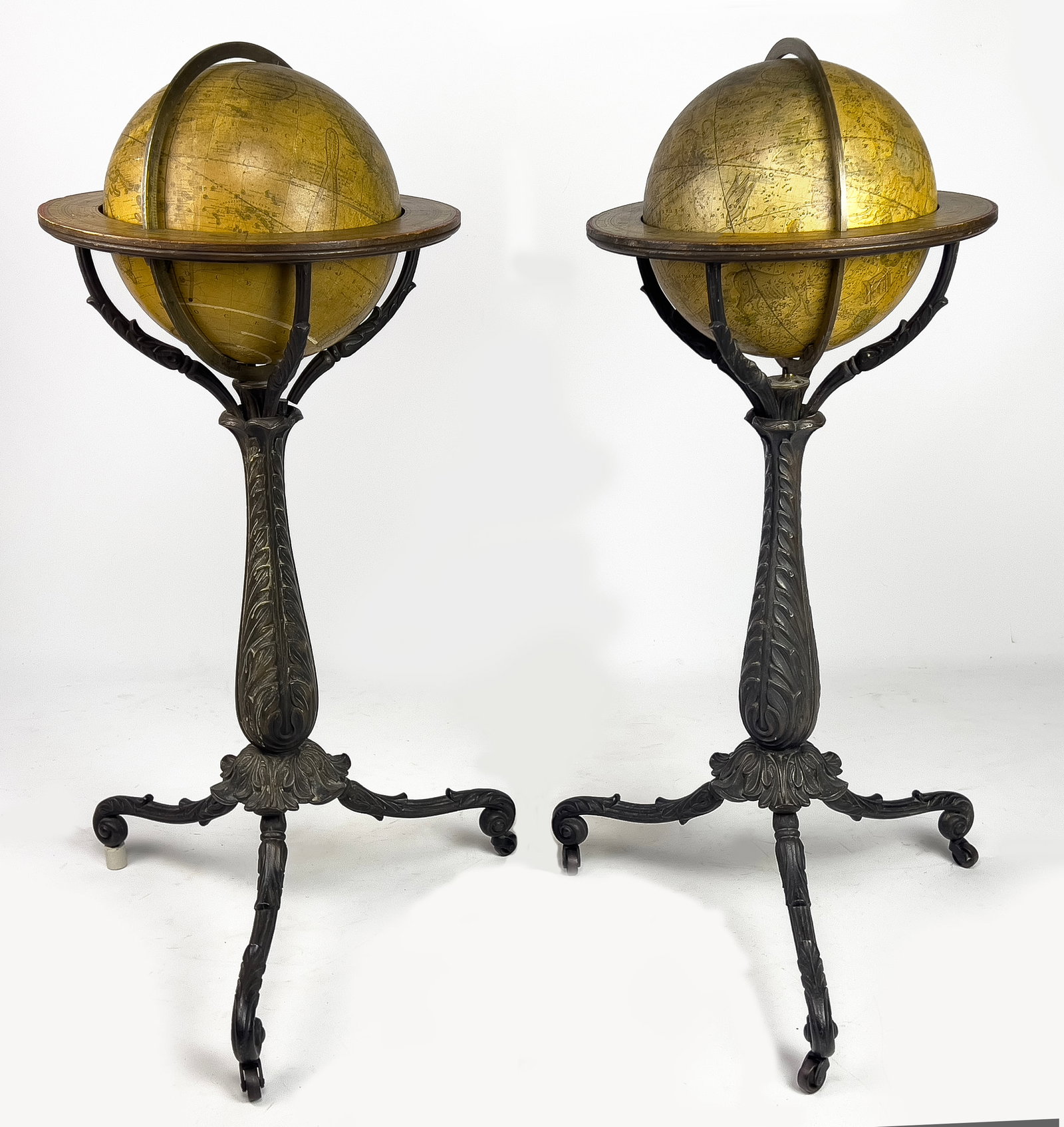 PAIR OF 19TH C. LORING FLOOR GLOBES, BOSTON, 1854: Josiah Loring (Boston, c. 1775-1840)/Gilman Joslin celestial and terrestrial globes, both labeled 'Loring’s' and dated 1854: brass calibrated meridian; mounted in ornate cast iron stands with acanth