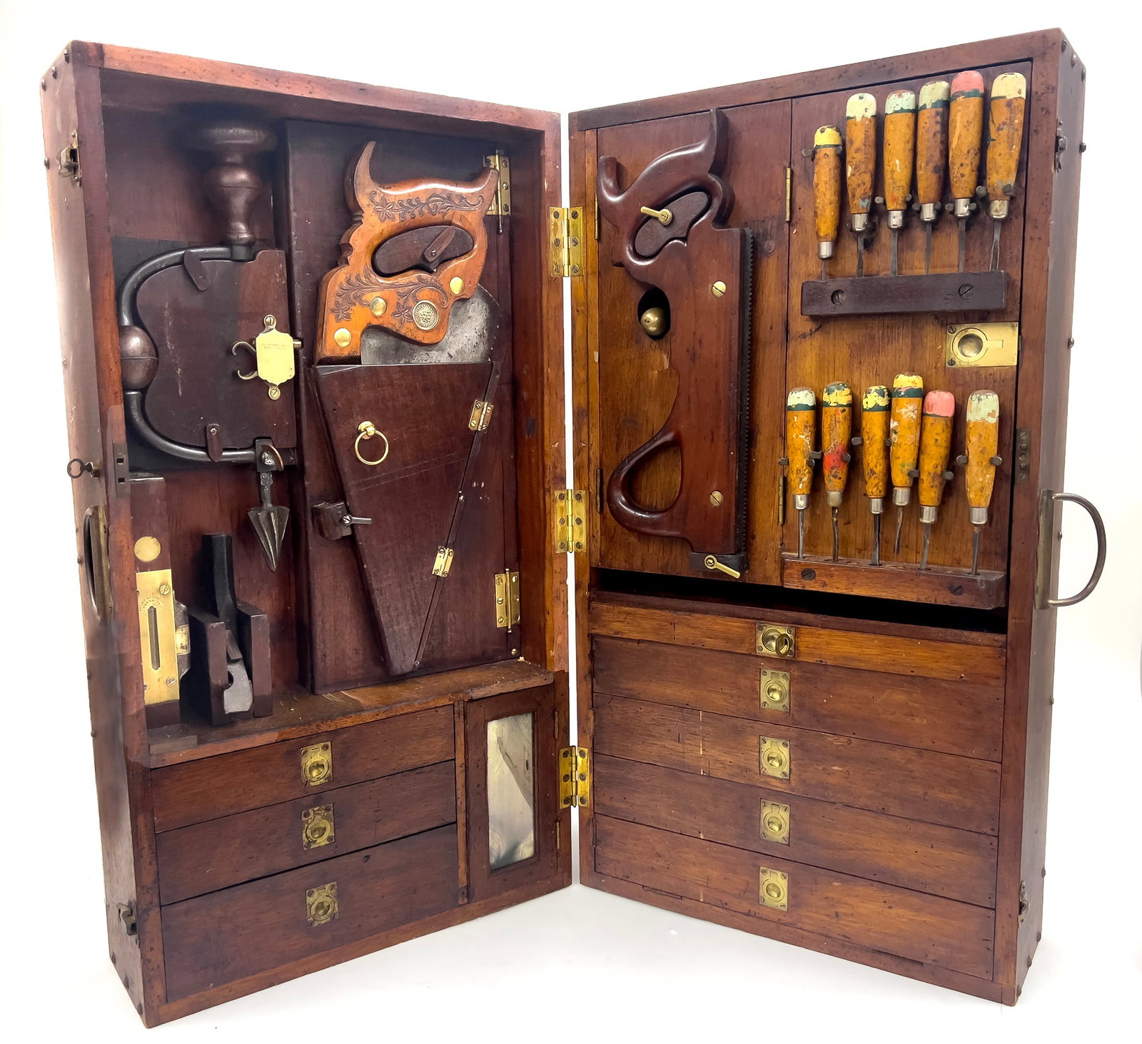 AN EXCEPTIONAL 19TH C. PORTABLE CARPENTER?S TOOL CHEST: complete and all original; vintage metal label: MOORE MACHINERY/LOS ANGELES- CO-SAN FRANCISCO; mahogany, folding case with original patina, fitted with eight drawers and hidden compartments, and hinge