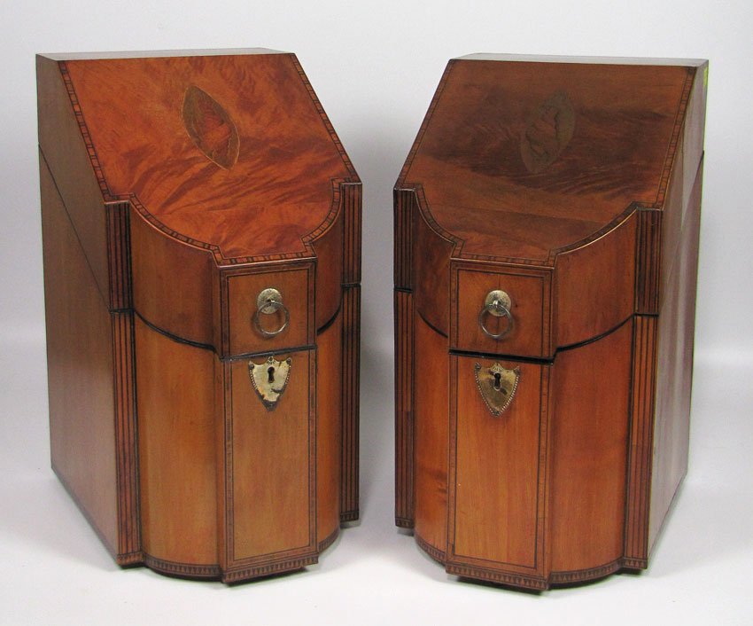 PAIR OF HEPPLEWHITE INLAID MAHOGANY SERPENTINE KNIFE: conch inlay to hinged lids, brass shield escutcheons, fitted cutlery interiors, 15”h; 8”w; 11”d