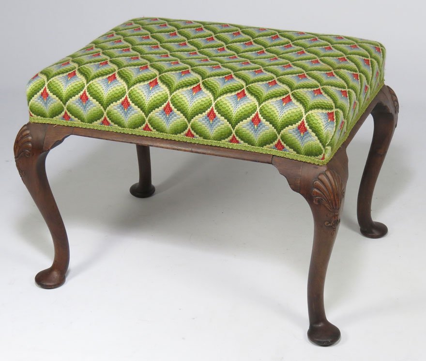 QUEEN ANNE-STYLE MAHOGANY FOOT STOOL: needlepoint tapestry, shell carved knees, 18.5”h; 24” x 18.5”