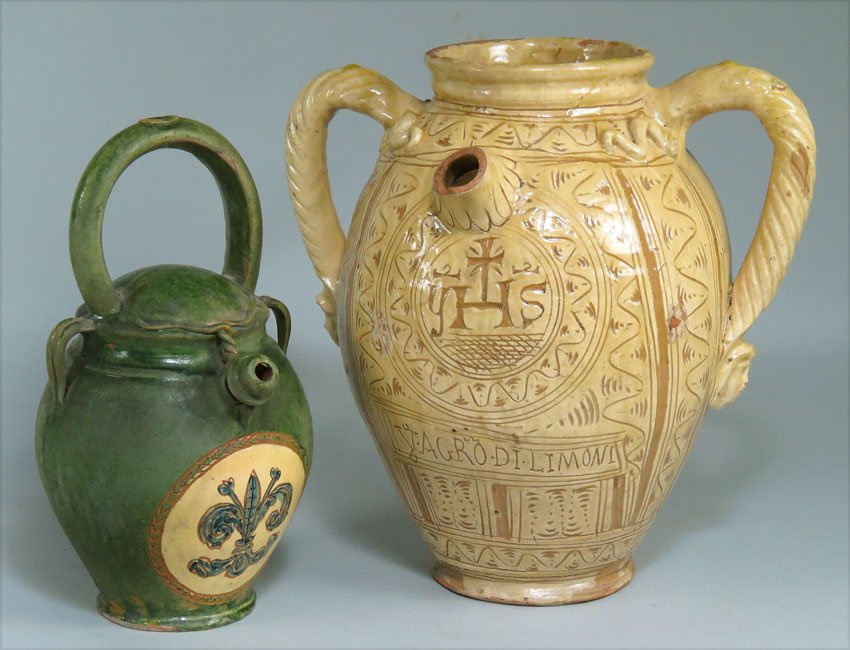 (on 2) ITALIAN SGRAFFITO OIL JAR: incised YAGROLDI.LIMONI and religious emblem under spout (portion of spout missing), double-twisted handles, lemon glaze, 11.5" (rim and foot roughness; drilled); along with a GREEN CERAMIC JUG with f