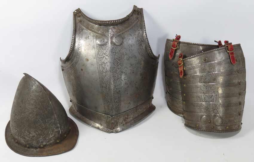 ITALIAN RENAISSANCE PARTIAL ARMOR: 17th c., an engraved steel breastplate; an engraved helmet; and a pair of shoulder defenses (pauldrons)