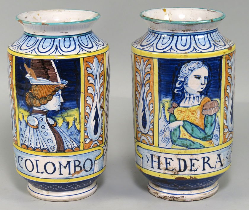PAIR OF ITALIAN MAIOLICA PORTRAIT JARS: late 19th c., footed cylinder-form, each with colorful half-portrait, one with female labeled HEDERA, the other a gentleman labeled COLOMBO, 10"