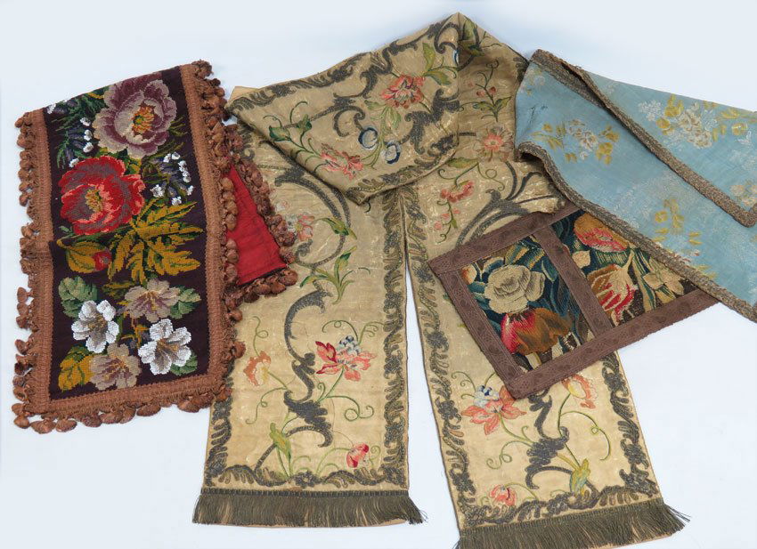 (4) VARIOUS TEXTILES: two silk table runners, one floral embroidered with metallic thread, metal fringe, 11" by 80" (silk deteriorated); a small blue silk brocade table runner, 39"; a floral needlepoint and bead table runn